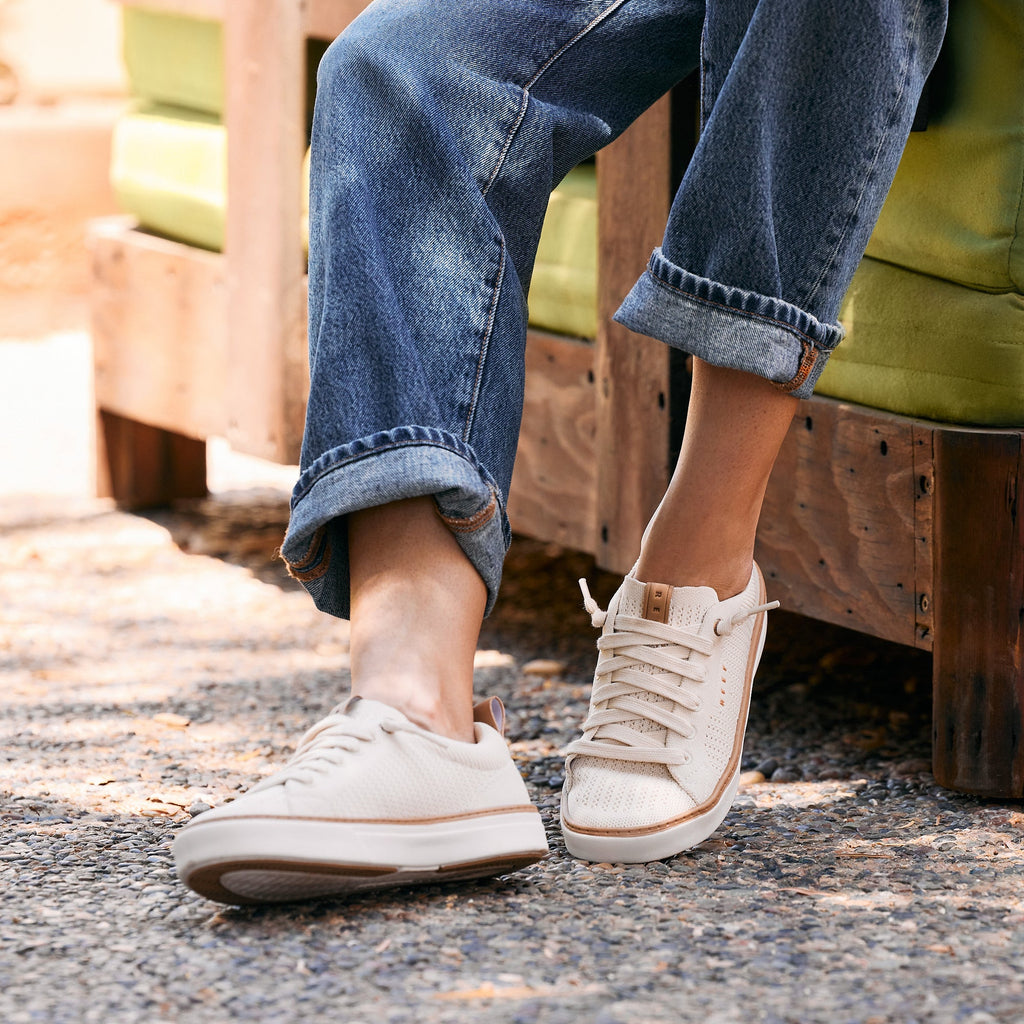 Lay Day Lite off white sneakers, one facing left and one facing forward, shown with cushioned comfort