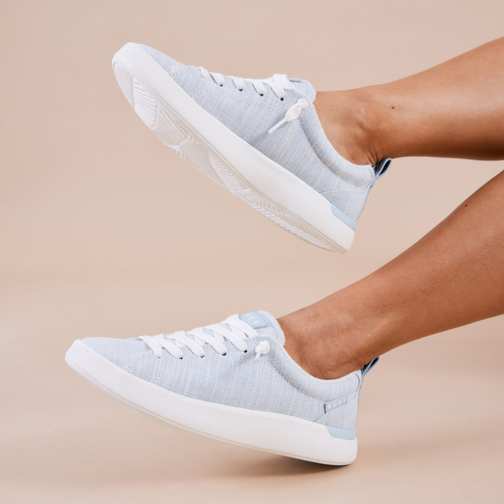 Side view of Neptune Alana women's sneaker in light blue textile with extra cushioning, arch support, and lightweight design.