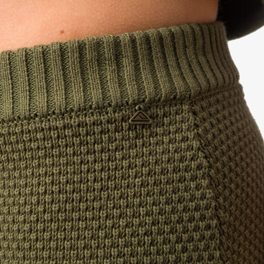Close-up of the waistband and knit texture of the olive Up North Sweater Skirt for women, showcasing comfort and detail.