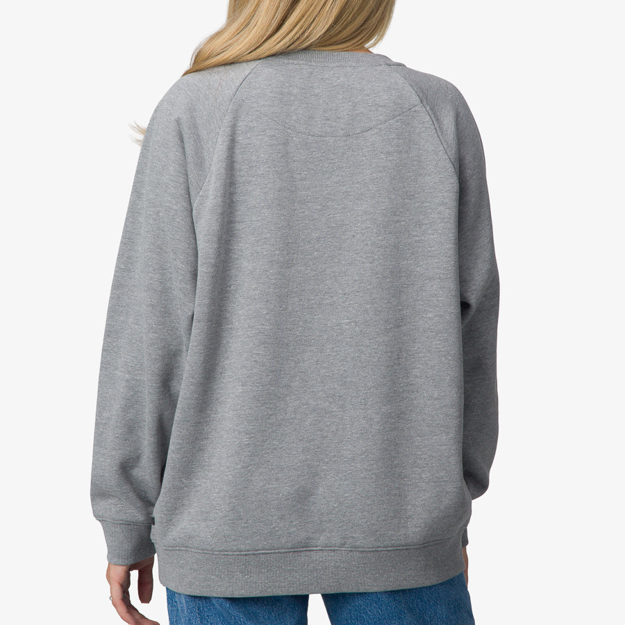 Back view of women's Oversized Raglan Fleece in heather grey, soft and comfortable beach-inspired apparel