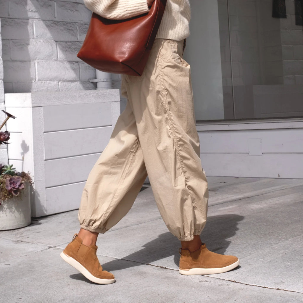 Side view of Neptune Athena women's footwear in natural suede facing right, showcasing extra cushioning and arch support.