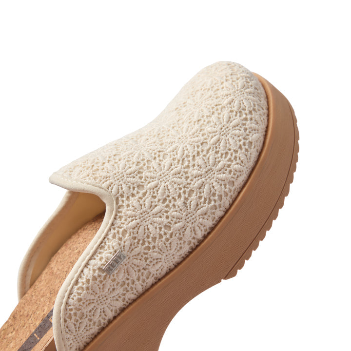 Vista Skye women's left shoe facing right, close-up of upper with cream lace pattern and platform sole, beach-inspired comfort