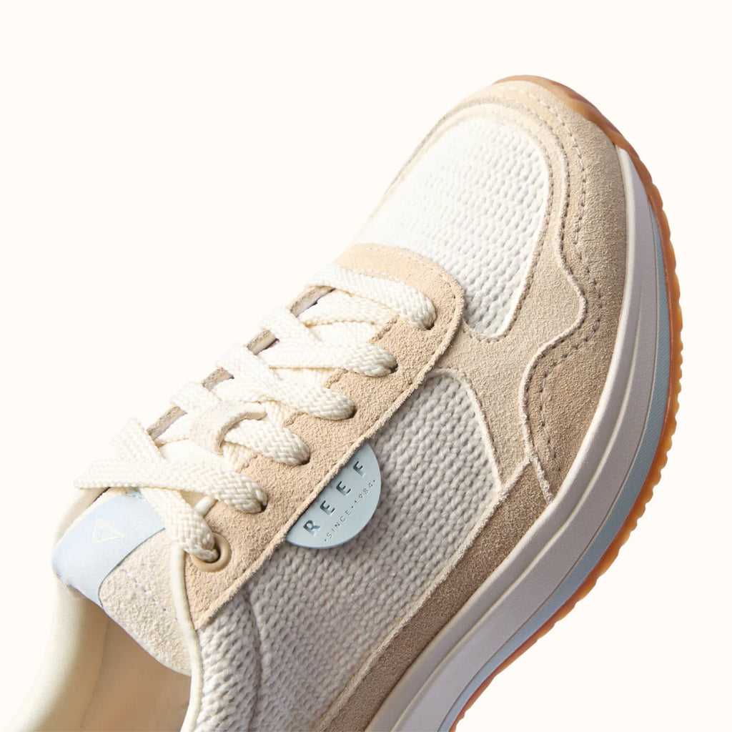 Venice Sonny x Jenny sneaker close-up showing front and side views with textured knit and soft-rebound cushioning