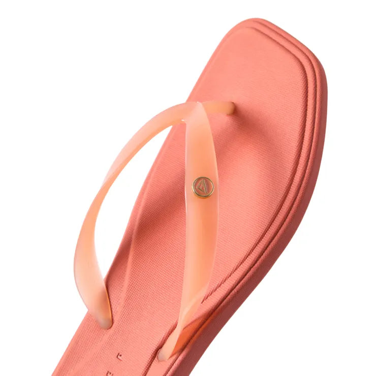 Solaye facing up, women's orange flip-flop with sleek jelly strap, square toe, water-friendly EVA, beach-inspired comfort.