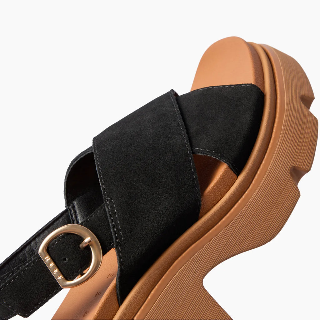 Vista Luxe Ava black suede sandal facing upper right, close-up of crossover straps, buckle, and cushioned footbed