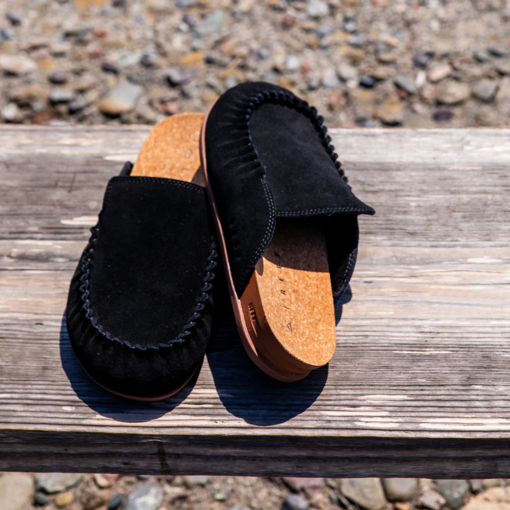 Pair of black Vista Myra clogs facing forward, women's leather slip-ons with cork footbeds and enhanced arch support for comfort.