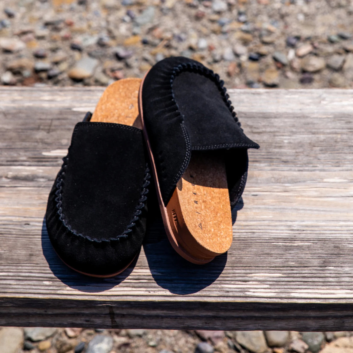 Pair of black Vista Myra clogs facing forward, women's leather slip-ons with cork footbeds and enhanced arch support for comfort.