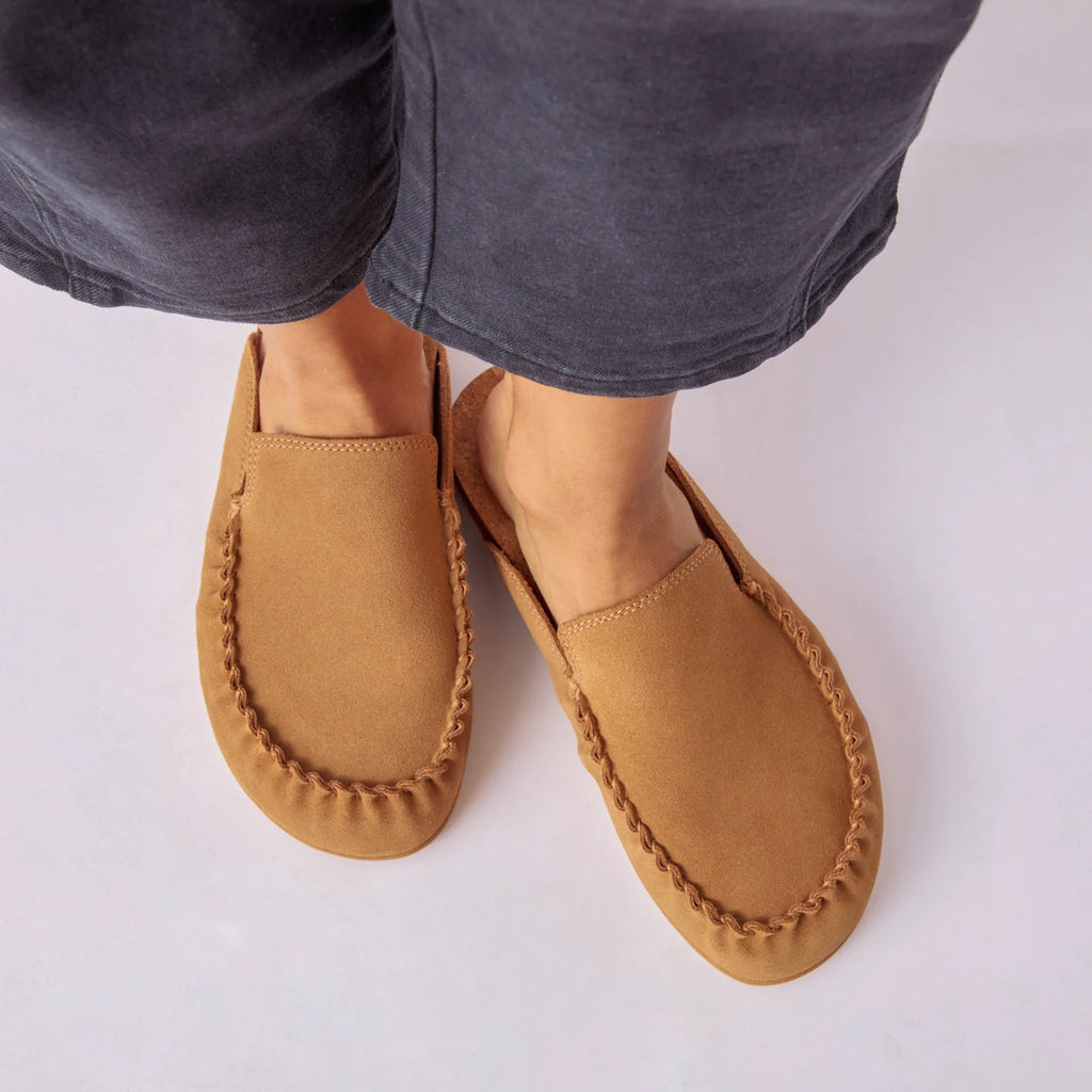 Woman wearing Vista Myra tan leather clogs facing forward with detailed stitching, slip-on comfort for casual everyday wear.