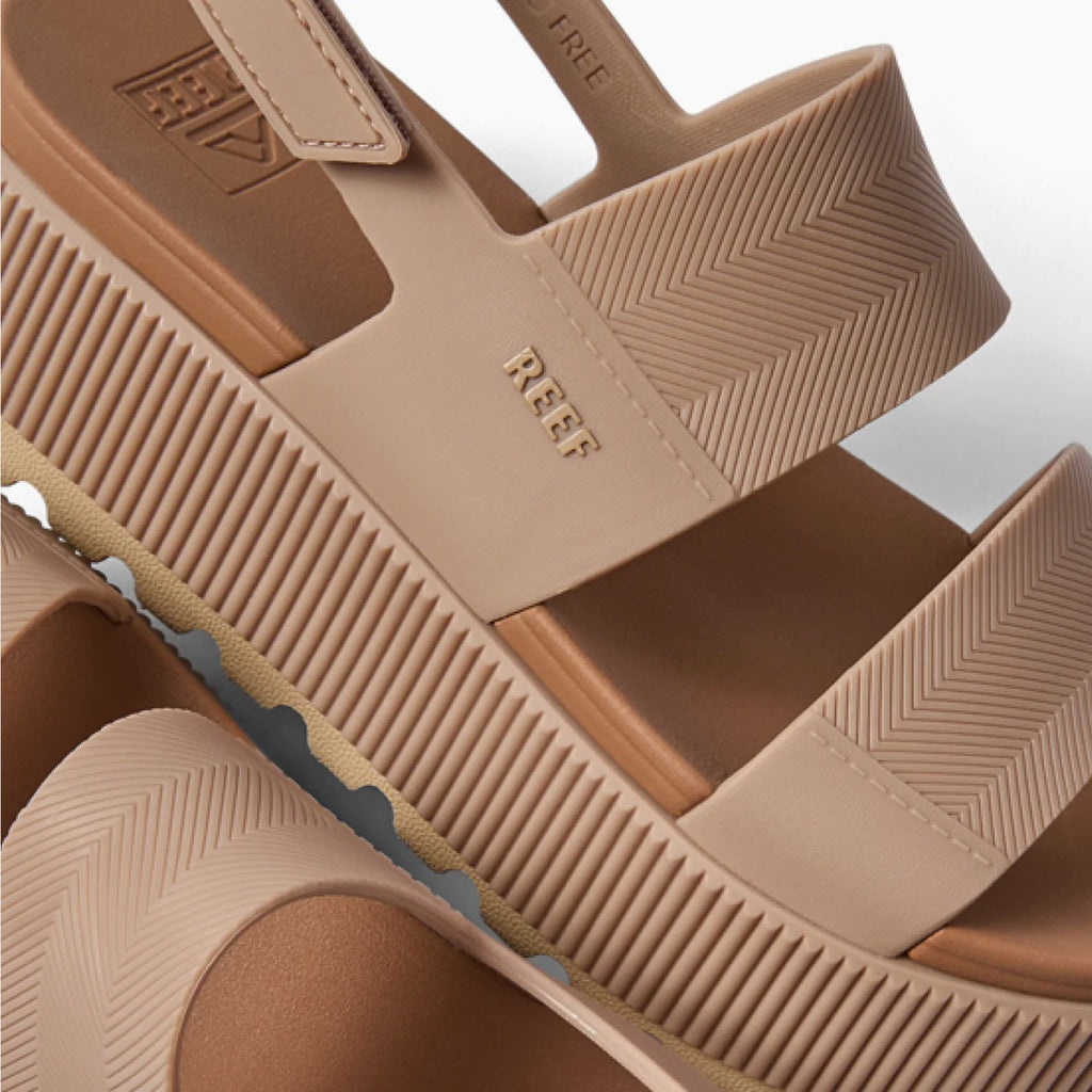 Close-up of the top and side of the Water Vista Higher sandal in warm taupe, showing straps and textured sole facing right