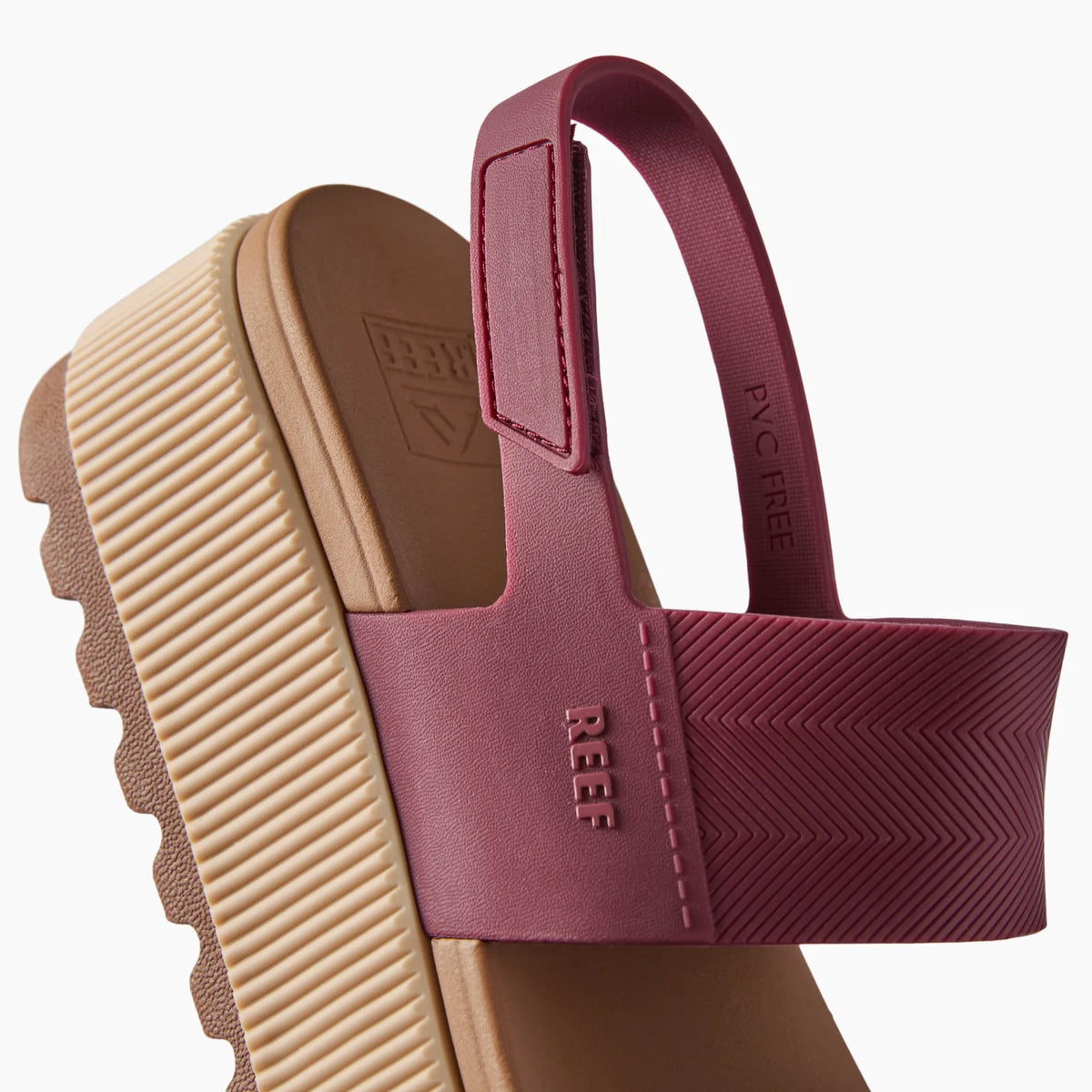 Water Vista Higher sandal facing left, close-up of maroon strap and beige cushioned arch support sole with REEF branding.