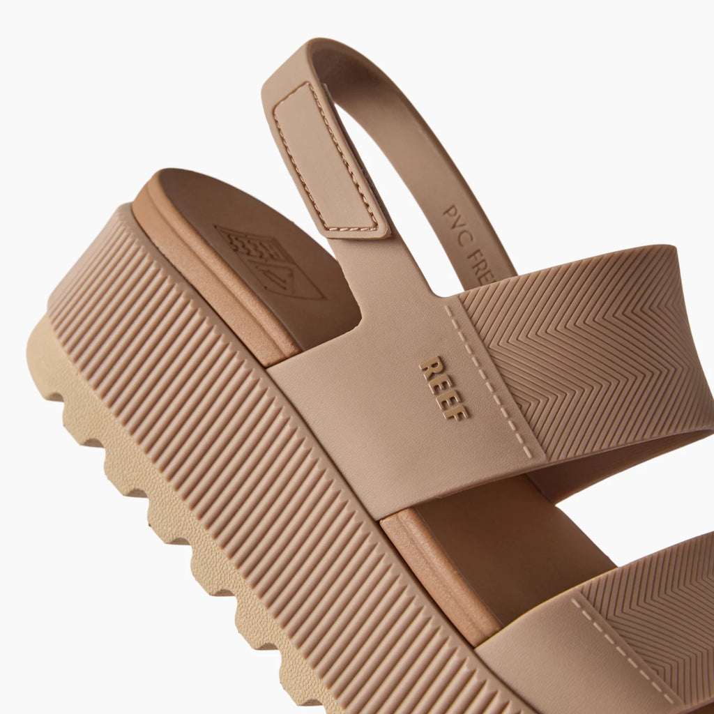 Close-up of the right-facing heel and straps of the warm taupe Water Vista Higher sandal with arch support and cushioning.