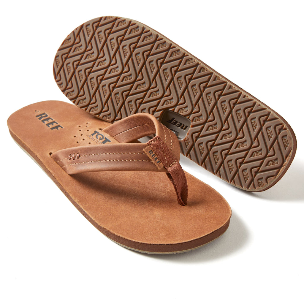 Reef Draftsmen men's sandals showing top view and textured sole, featuring soft-rebound cushioning and anatomical arch support.