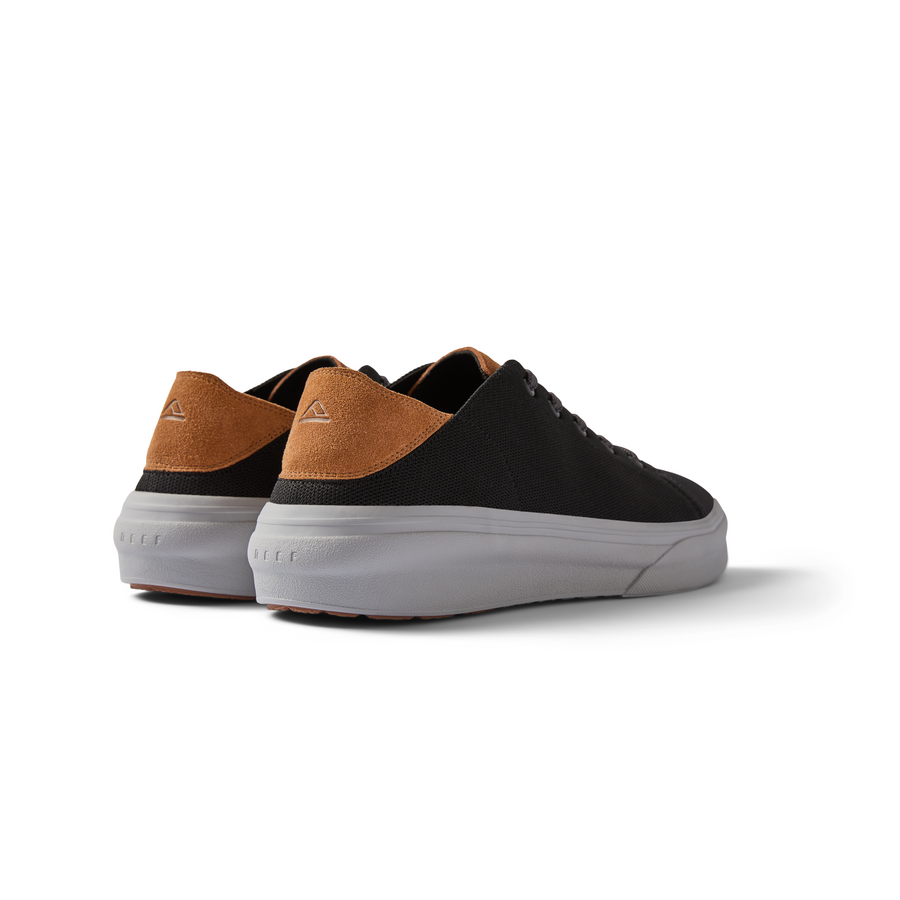 Atlantic men's black and tan sneaker viewed from the back right showing cushioned heel and arch support design