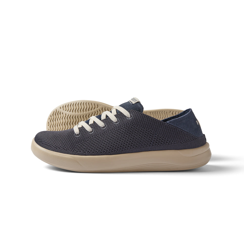 Neptune men's sneaker facing left, featuring breathable navy mesh upper and cushioned sole for beach comfort.