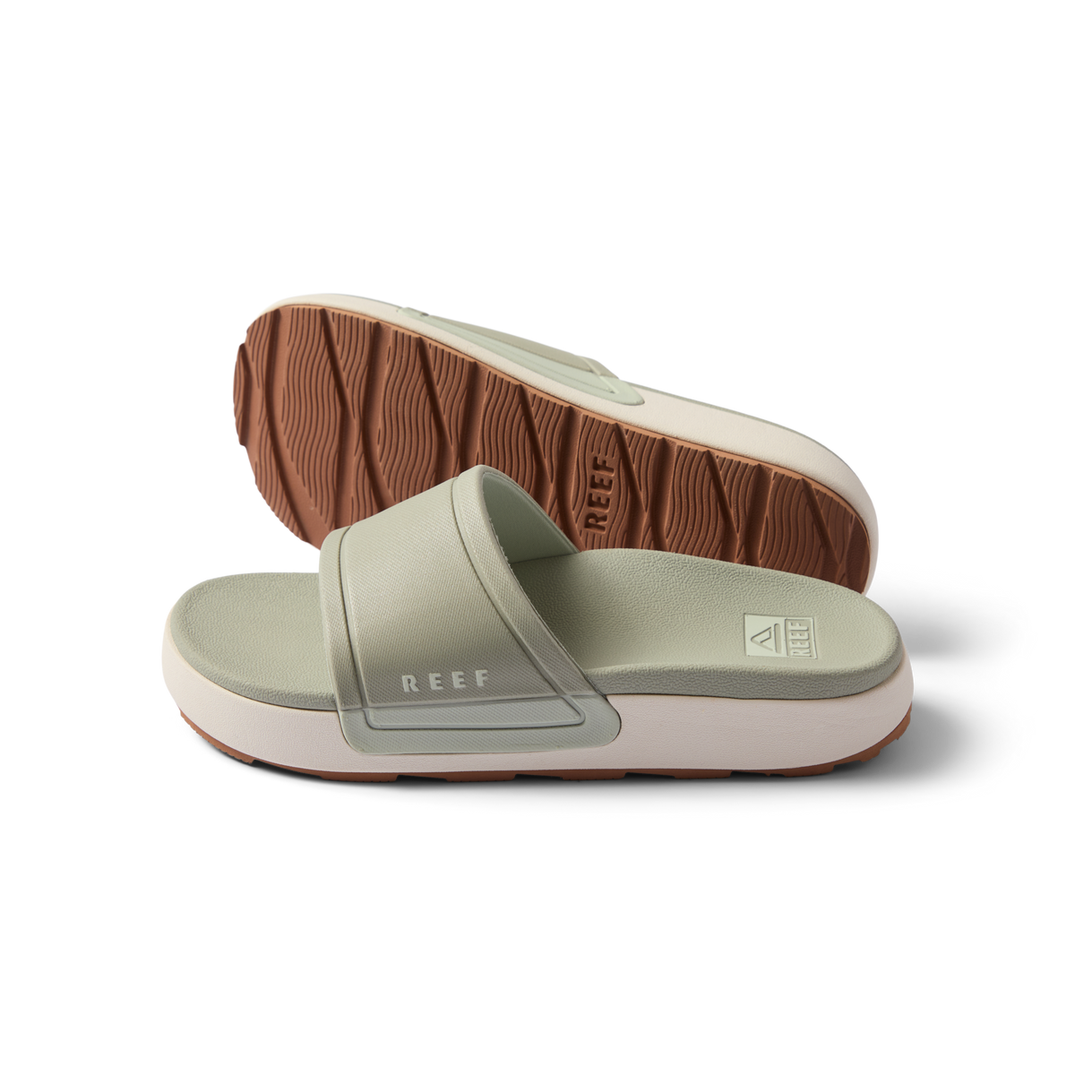 Pair of women's Sydnee Cutback Low slides in sage facing right, showing top and sole with textured brown outsole.