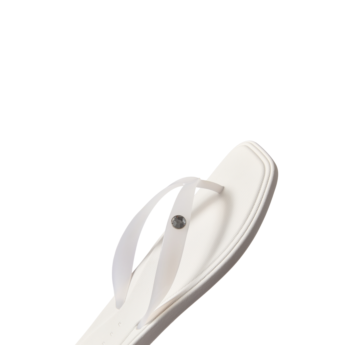 Solaye women's white sandal facing right showing toe post and cushioned footbed, beach-inspired comfort design.