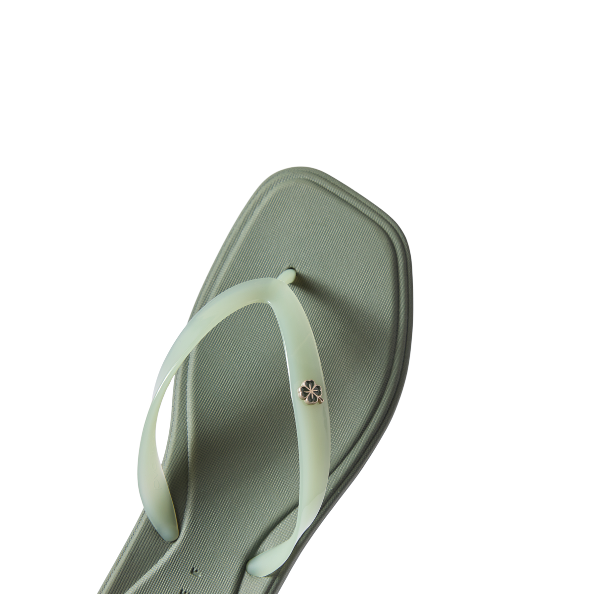 Solaye women's water-friendly flat sandal facing right, close-up of square toe and soft footbed in light green