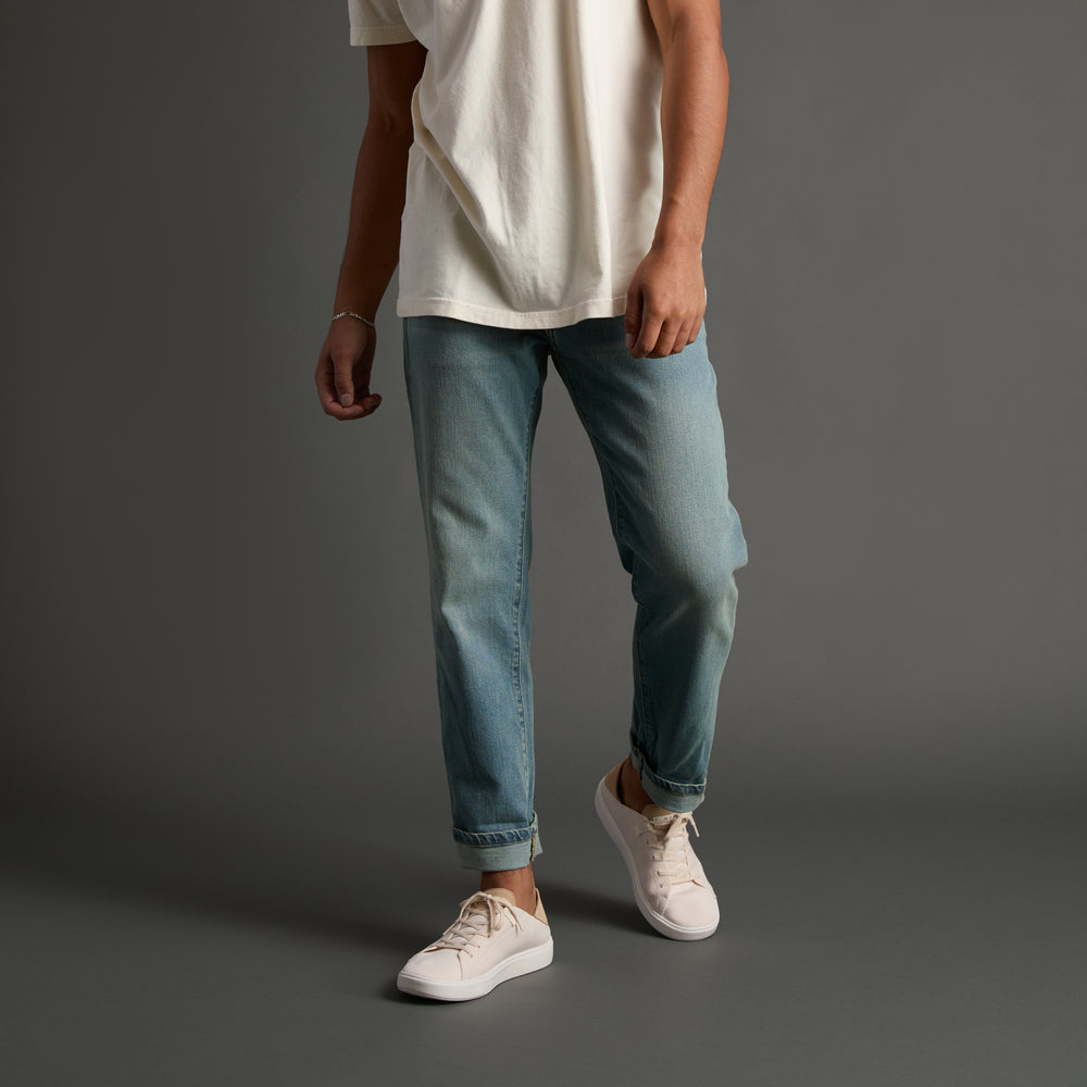 Men’s Terramar sneakers facing left, white knit upper with soft cushioning and anatomical arch support.