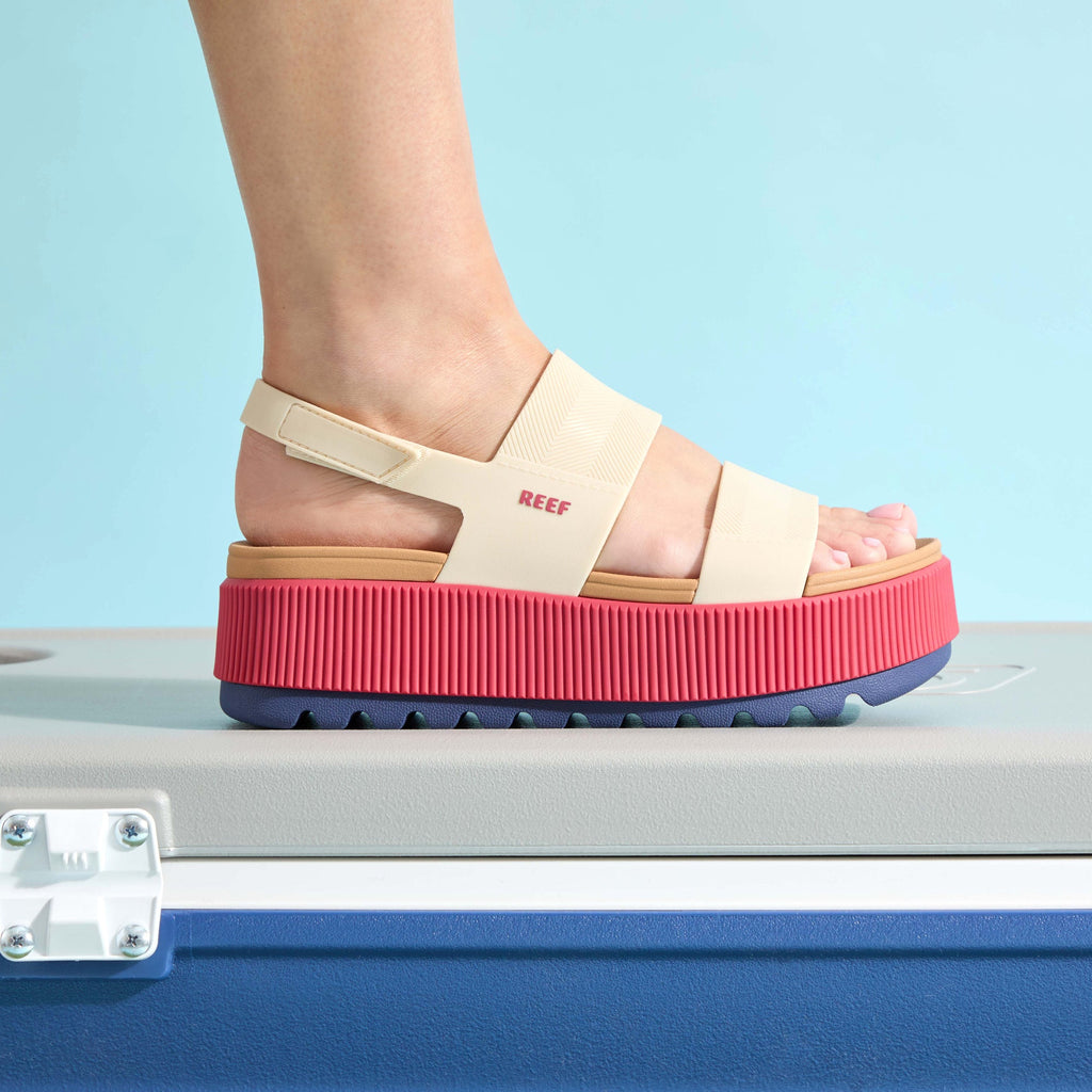 Side view of Water Vista Higher sandal for women with pink platform sole and beige straps, highlighting comfort and arch support.
